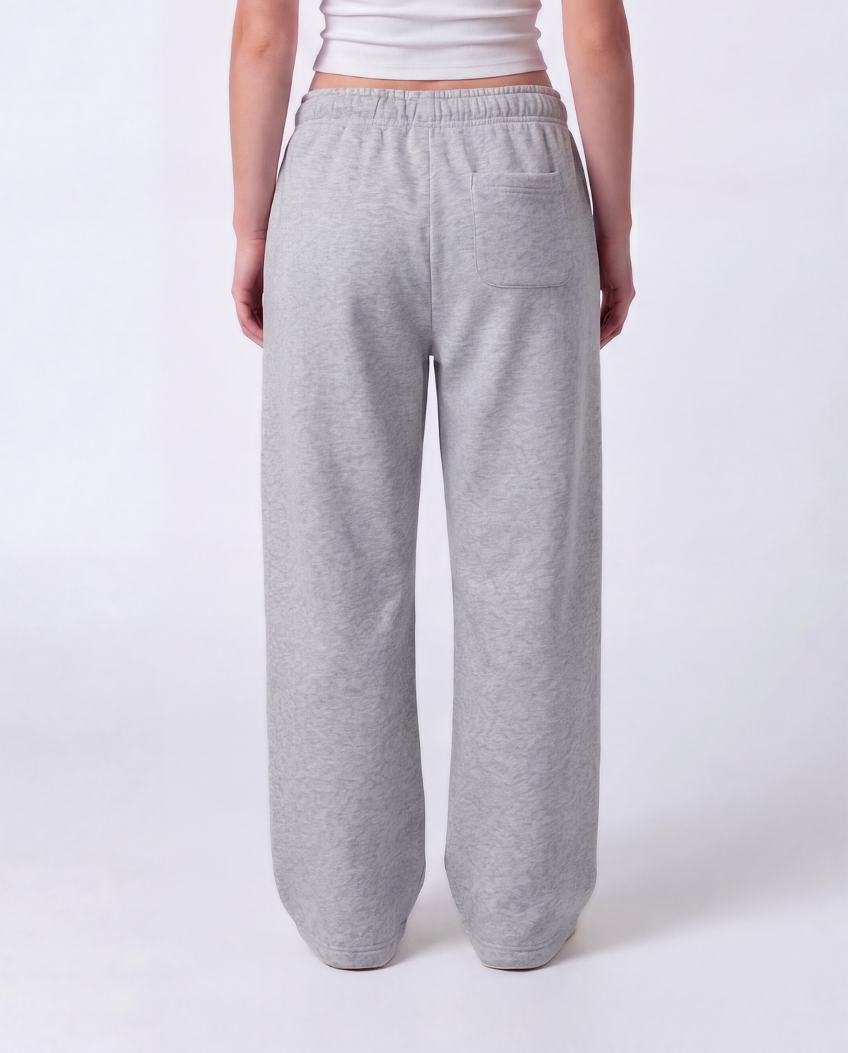 Essential Logo — Carrier Sweatpant — Female model close back (Reese), Marle #Model_F #Color_Marle