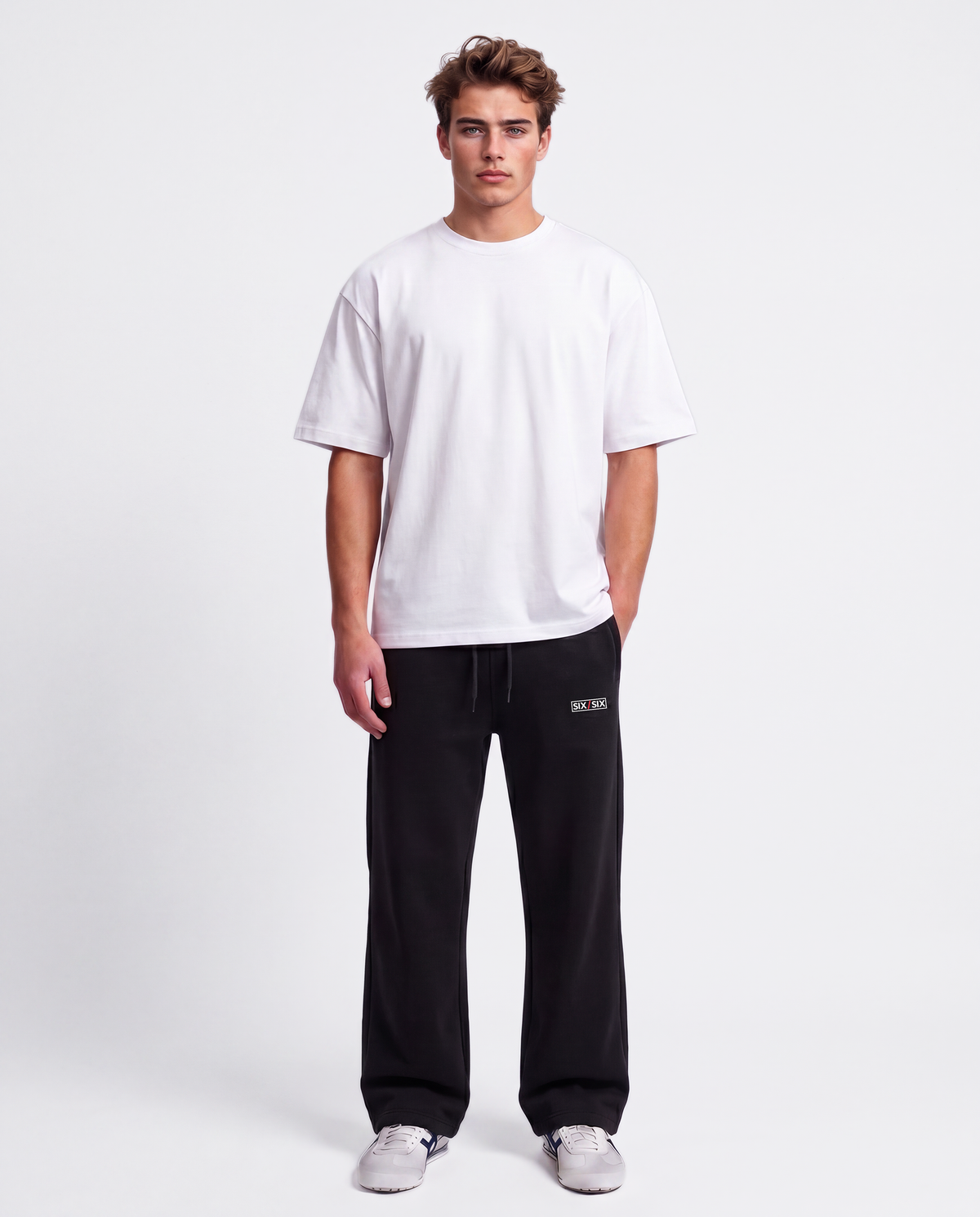 Essential Logo — Carrier Sweatpant — Male model full front (Brooks), Black #Model_M #Color_Black