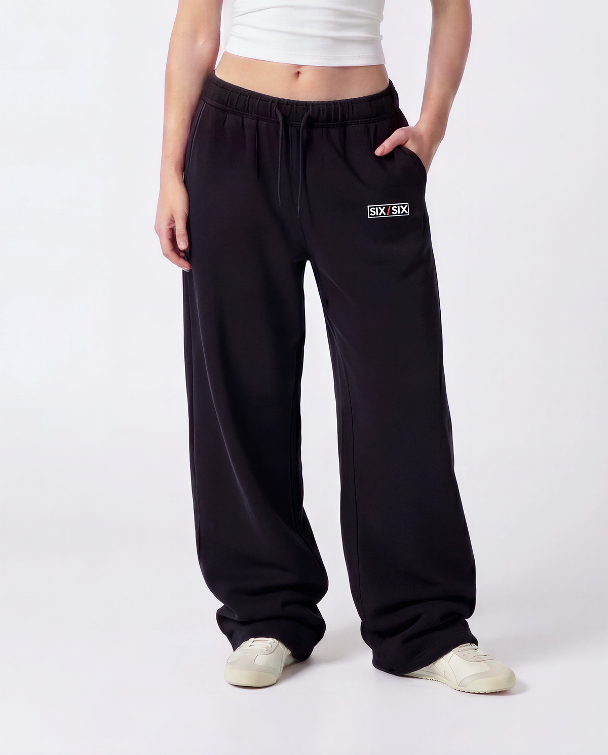 Essential Logo — Carrier Sweatpant — Female model close front (Reese), Black #Model_F #Color_Black