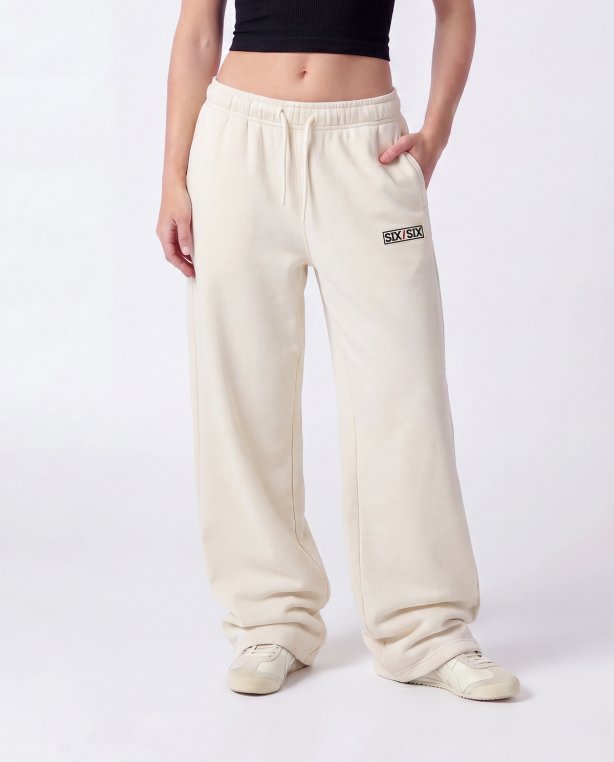 Essential Logo — Carrier Sweatpant — Female model close front (Reese), Bone #Model_F #Color_Bone