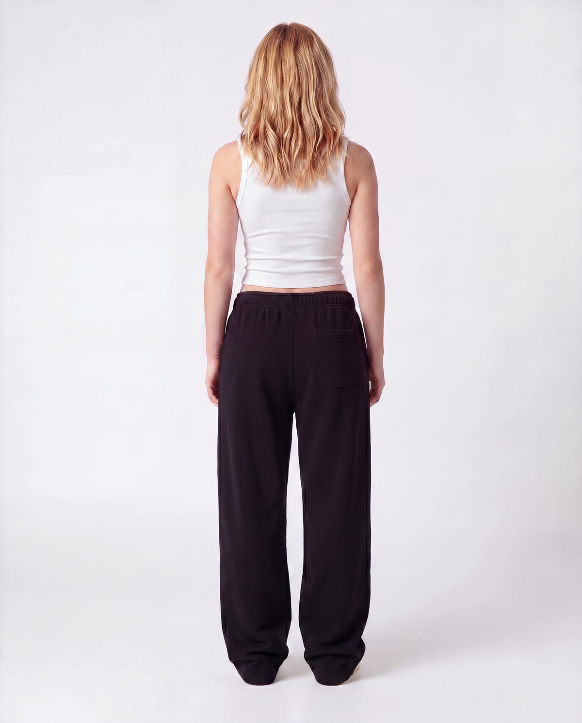 Essential Logo — Carrier Sweatpant — Female model full back (Reese), Black #Model_F #Color_Black