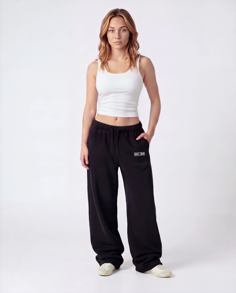 Essential Logo — Carrier Sweatpant — Female model full front (Reese), Black #Model_F #Color_Black