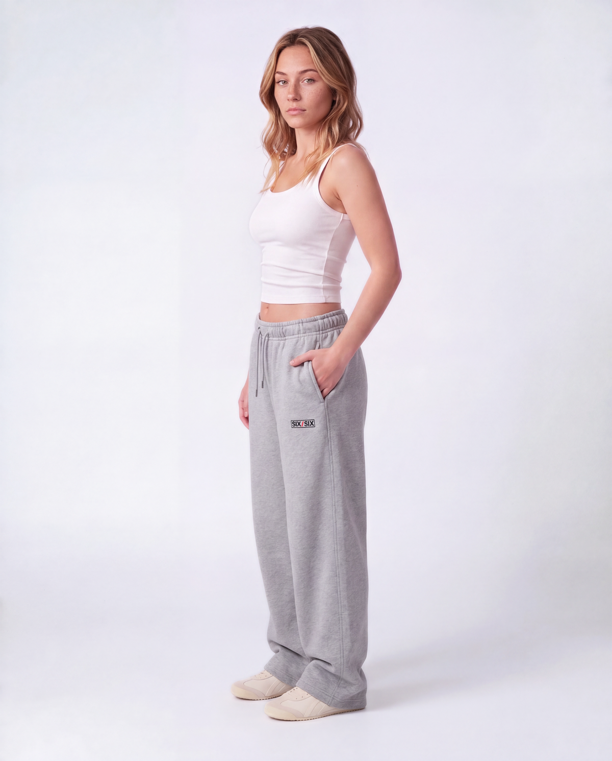 Essential Logo — Carrier Sweatpant — Female model full side (Reese), Marle #Model_F #Color_Marle