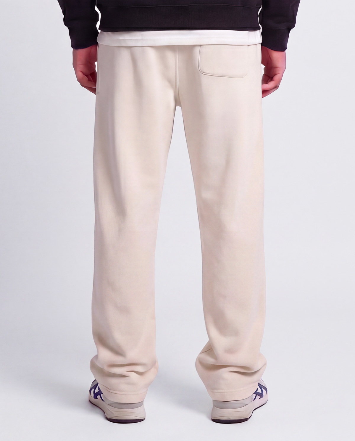 Essential Logo — Carrier Sweatpant — Male model close back (Brooks), Bone #Model_M #Color_Bone