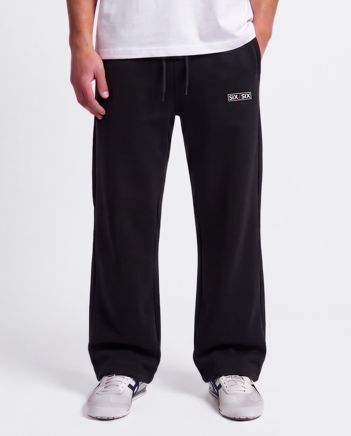 Essential Logo — Carrier Sweatpant — Male model close front (Brooks), Black #Model_M #Color_Black