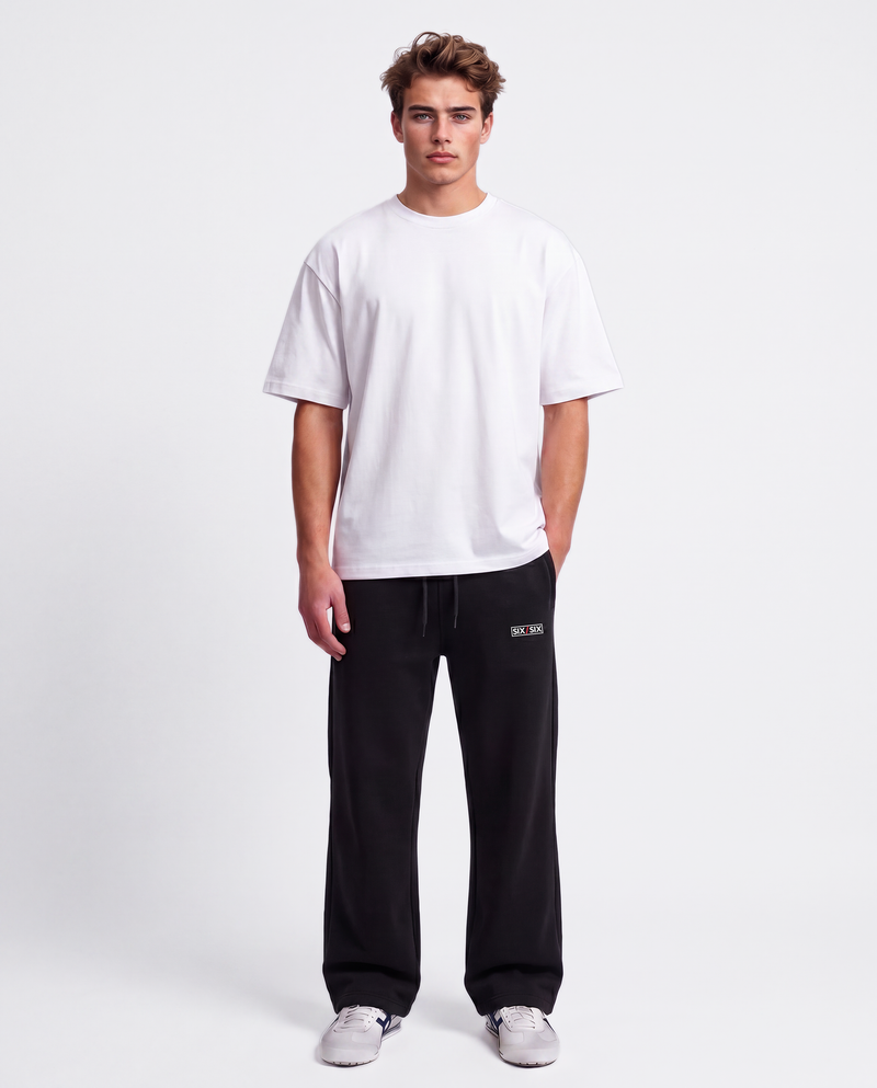 Essential Logo — Carrier Sweatpant — Male model full front (Brooks), Black #Model_M #Color_Black