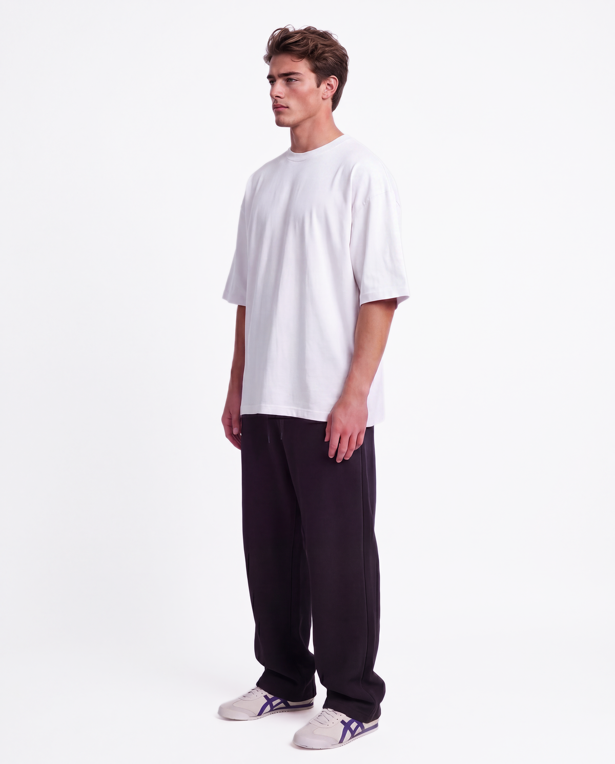 Essential Logo — Carrier Sweatpant — Male model full side (Brooks), Black #Model_M #Color_Black