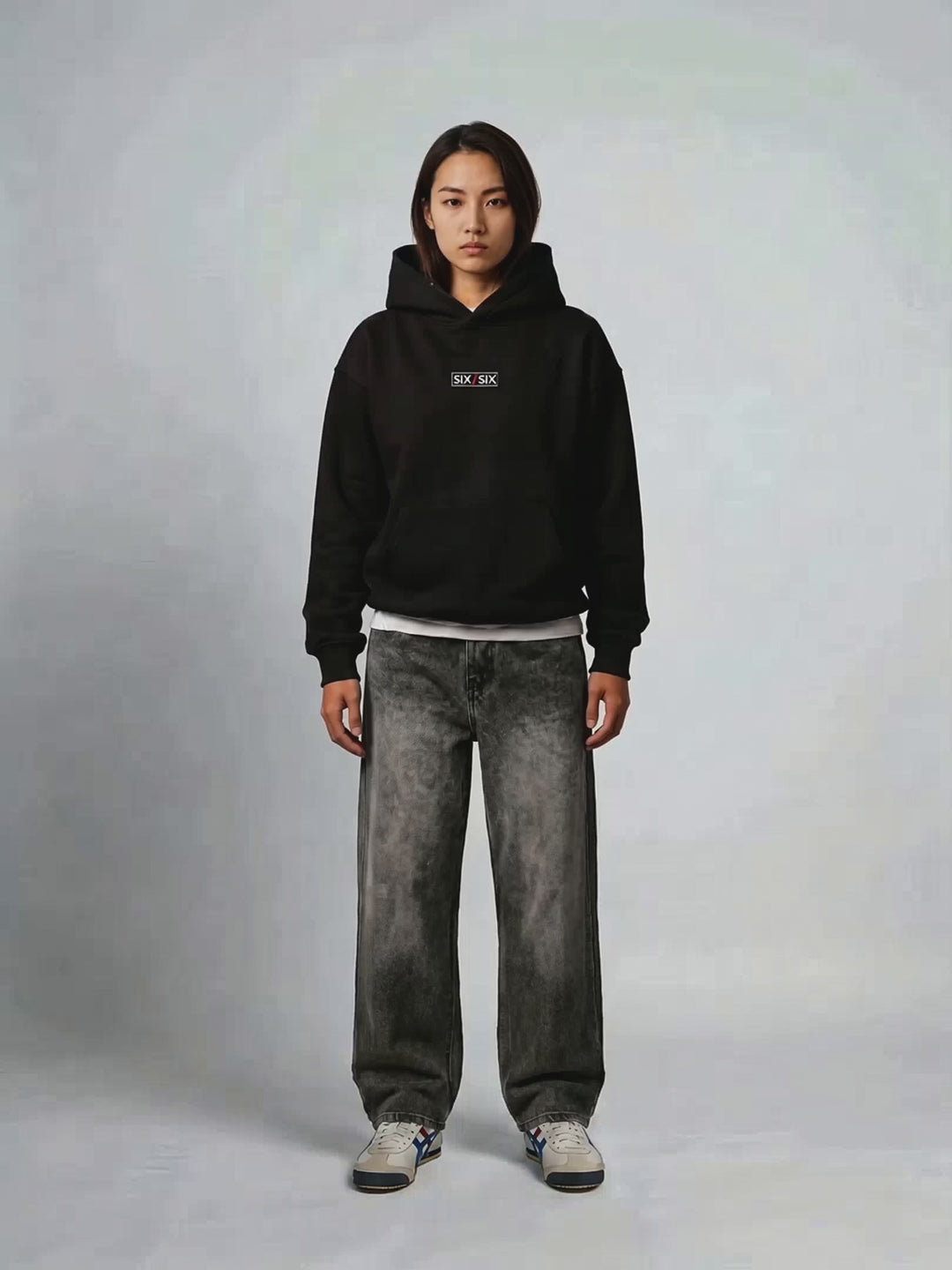 Score In Silence hoodie PDP video — female model Rei, hood-up turnaround #Model_F